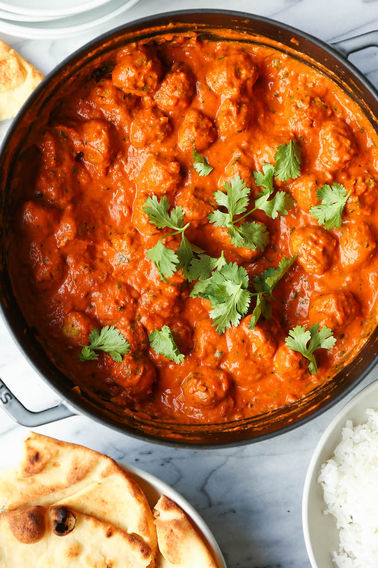 Butter Chicken Meatballs - Everyone's favorite butter chicken made into the most tender, most amazing meatballs! So saucy, so good. Serve with rice + naan!