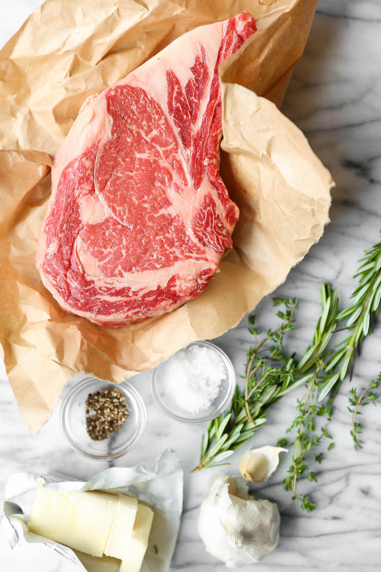 How to Cook a Ribeye Steak - Why go to a steakhouse when you can make the most perfect ribeye right at home? Pan seared with the best garlicky herb butter!