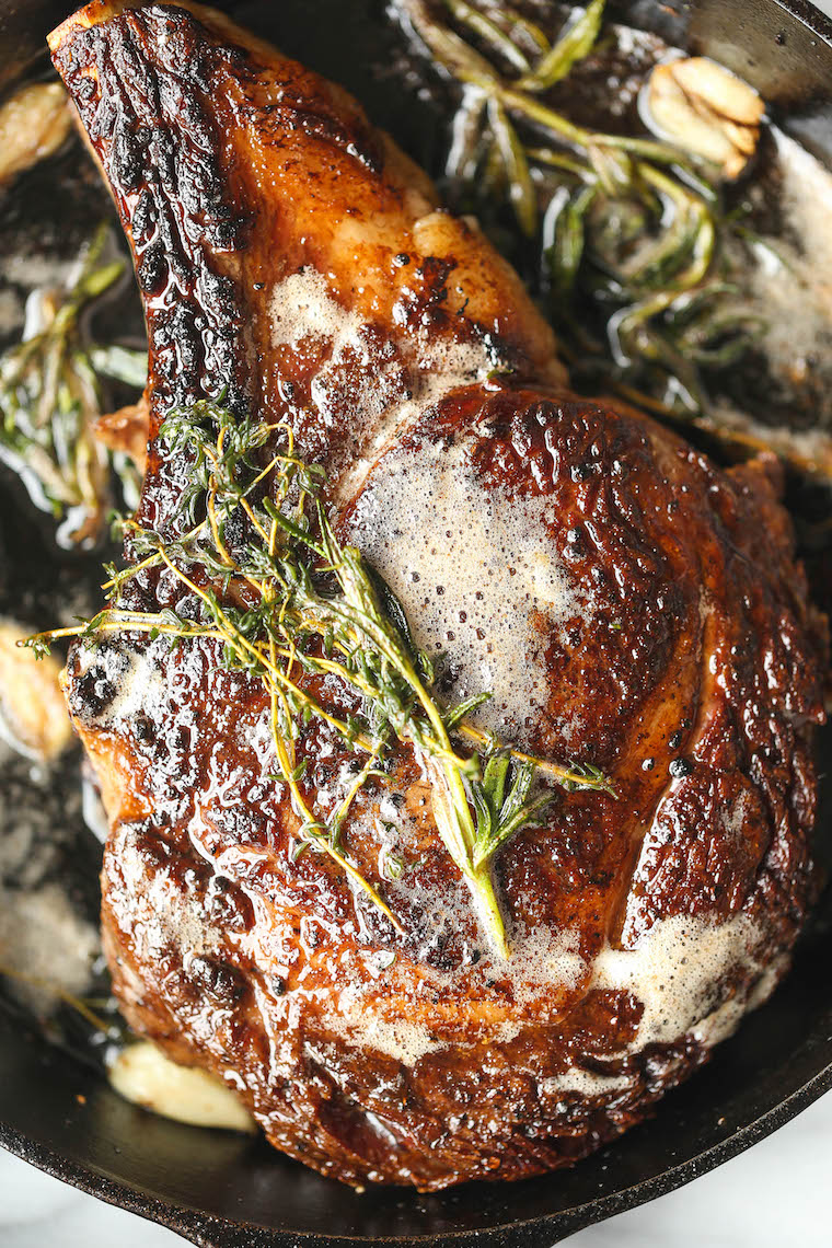 How to Cook a Ribeye Steak - Why go to a steakhouse when you can make the most perfect ribeye right at home? Pan seared with the best garlicky herb butter!