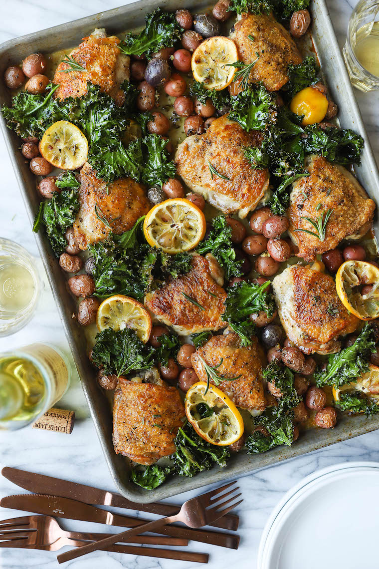 Sheet Pan Lemon Rosemary Chicken - SHEET PAN DINNER! Crispy, juicy chicken thighs with tender baby potatoes and crisped kale. So hearty, so good, so easy!