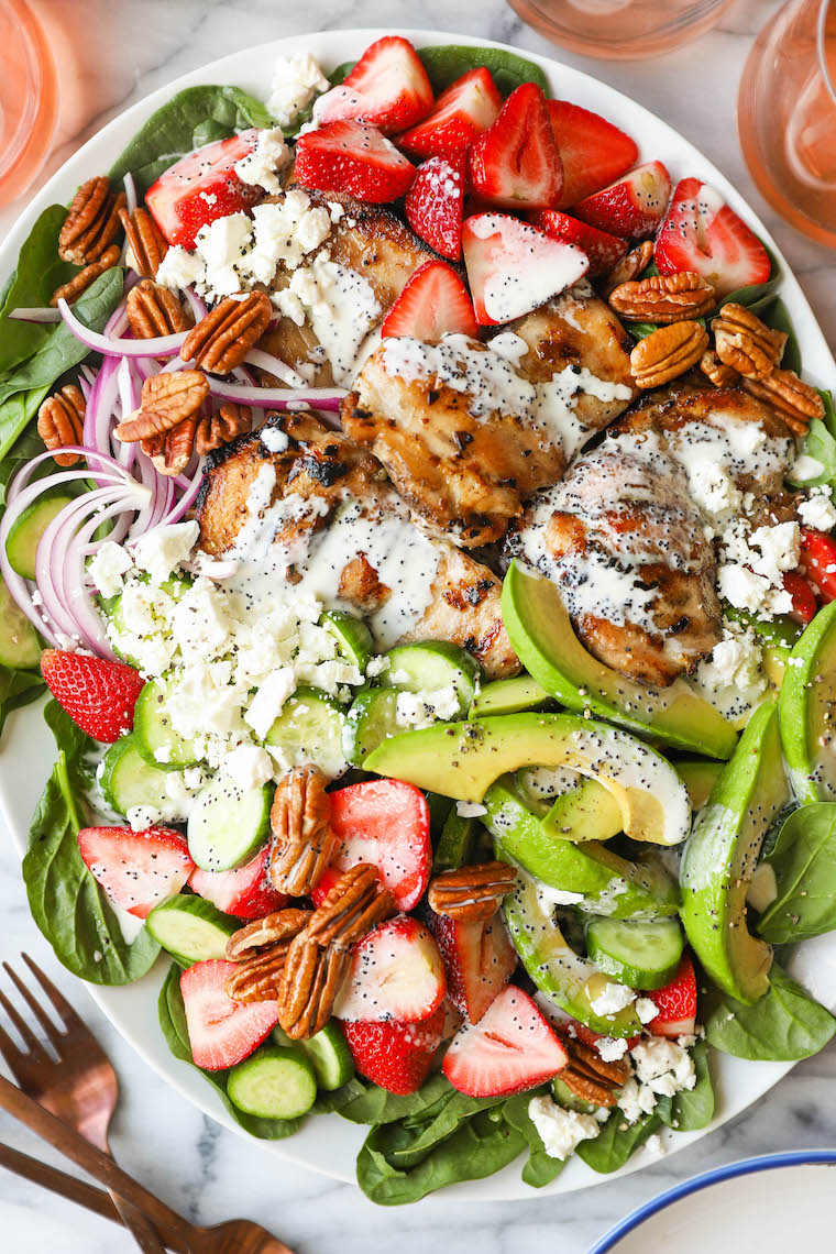 Strawberry Spinach Salad - A crowd favorite! Loaded with baby spinach, fresh strawberries, juicy, tender chicken thighs + the dreamiest poppy seed dressing!