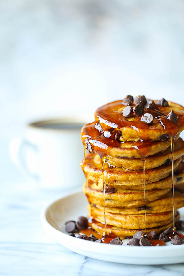Pumpkin Chocolate Chip Pancakes - The most amazing pumpkin pancakes - so light + fluffy and made with semisweet chocolate chips. PERFECTION.
