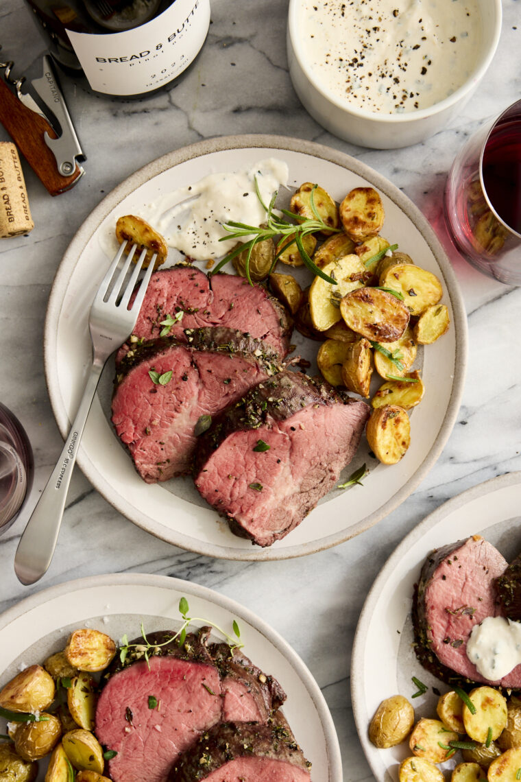 Garlic Rosemary Beef Tenderloin - Cooked low + slow, this is the most perfect (and only way to cook) tenderloin! So easy, so tender, so good.