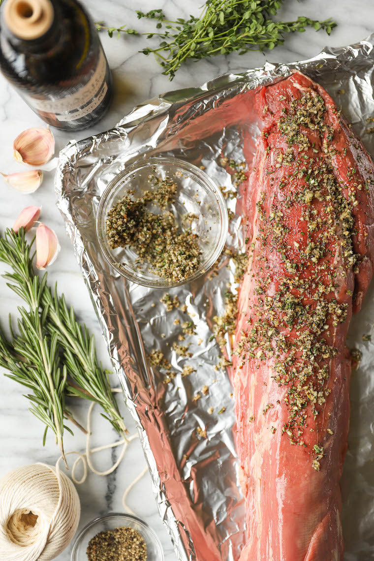 Garlic Rosemary Beef Tenderloin - Cooked low + slow, this is the most perfect (and only way to cook) tenderloin! So easy, so tender, so good.