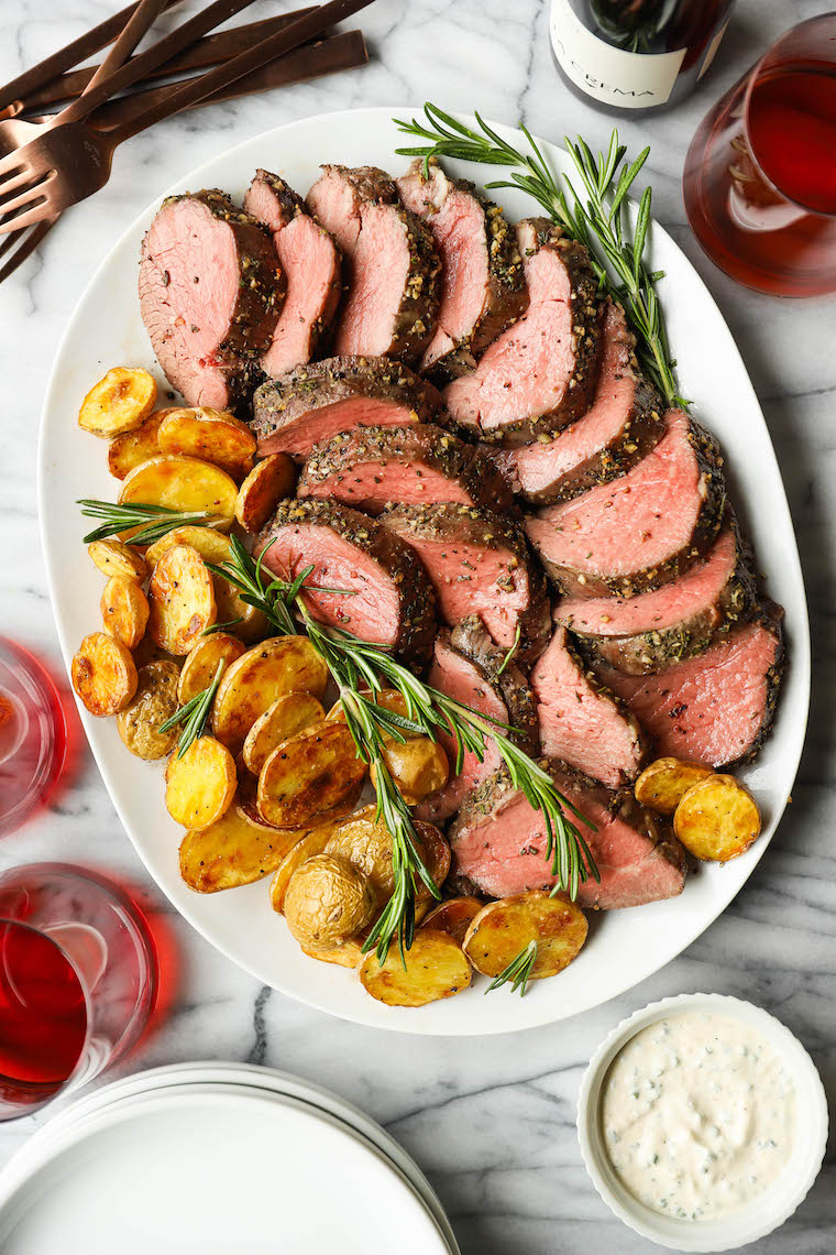 Garlic Rosemary Beef Tenderloin - Cooked low + slow, this is the most perfect (and only way to cook) tenderloin! So easy, so tender, so good.