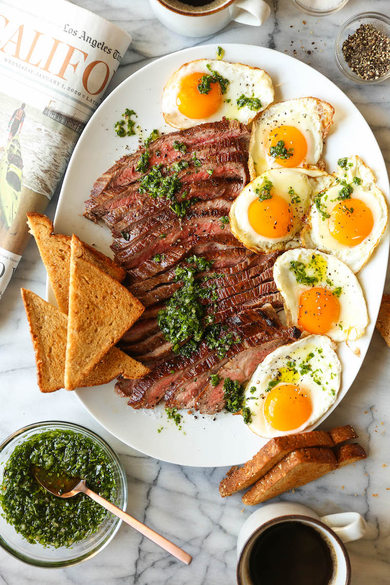 Best Ever Steak and Eggs - So quick, easy, and fancy pants without any of the hard work! Served with the most amazing herb sauce. SO SO GOOD.