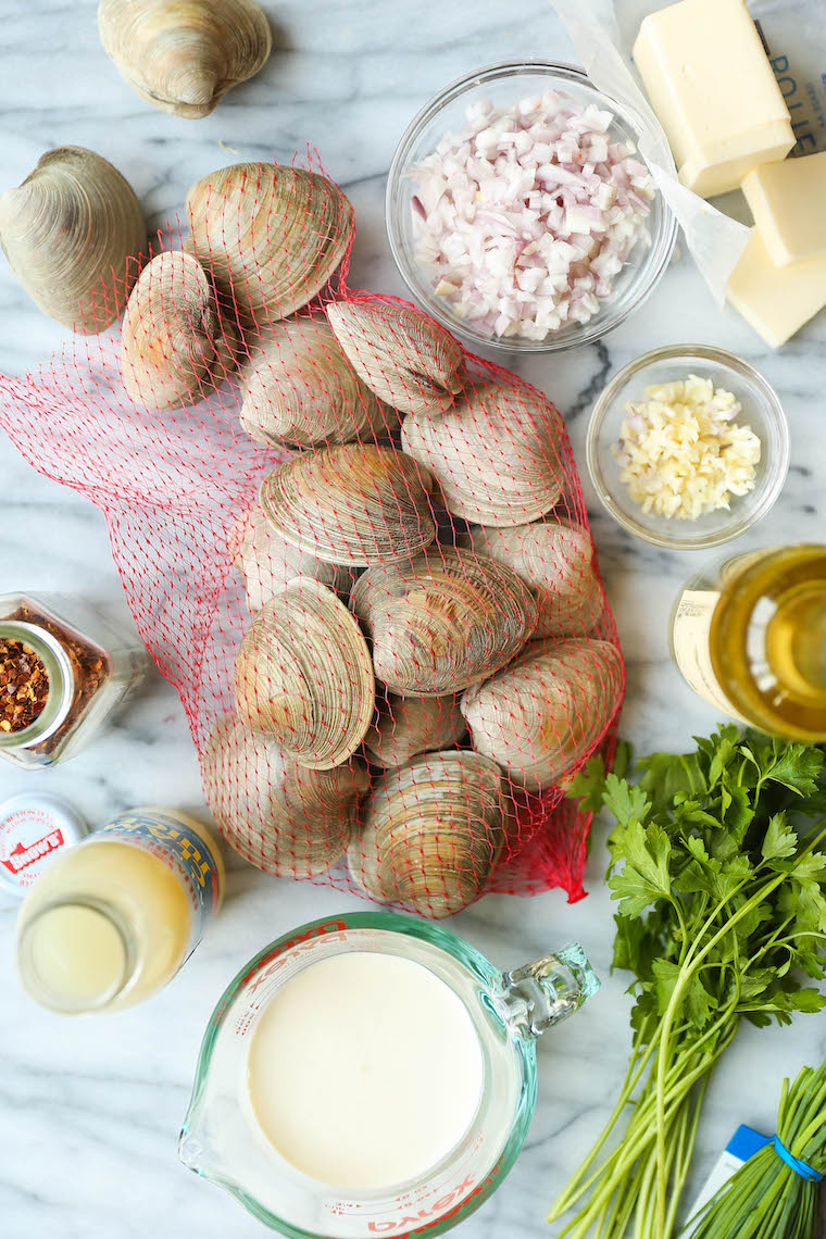 Garlic Butter Clams with White Wine Cream Sauce - The BEST steamed clams ever! So garlicky and buttery, served with a heavenly cream sauce!