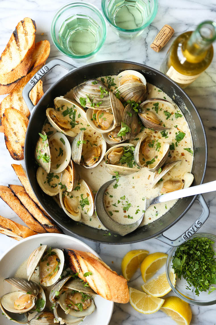 Garlic Butter Clams with White Wine Cream Sauce - The BEST steamed clams ever! So garlicky and buttery, served with a heavenly cream sauce!