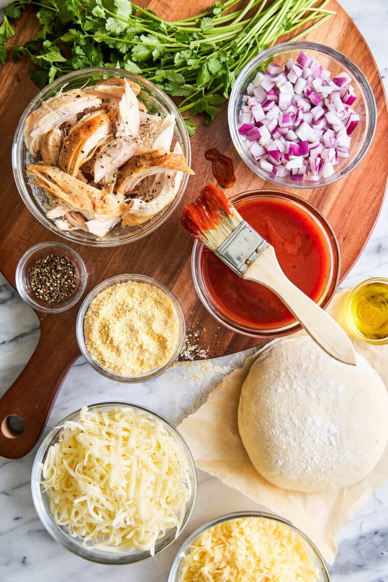 BBQ Chicken Pizza - You can use homemade pizza dough (or store-bought) with leftover rotisserie chicken for the best (speediest) dinner ever!