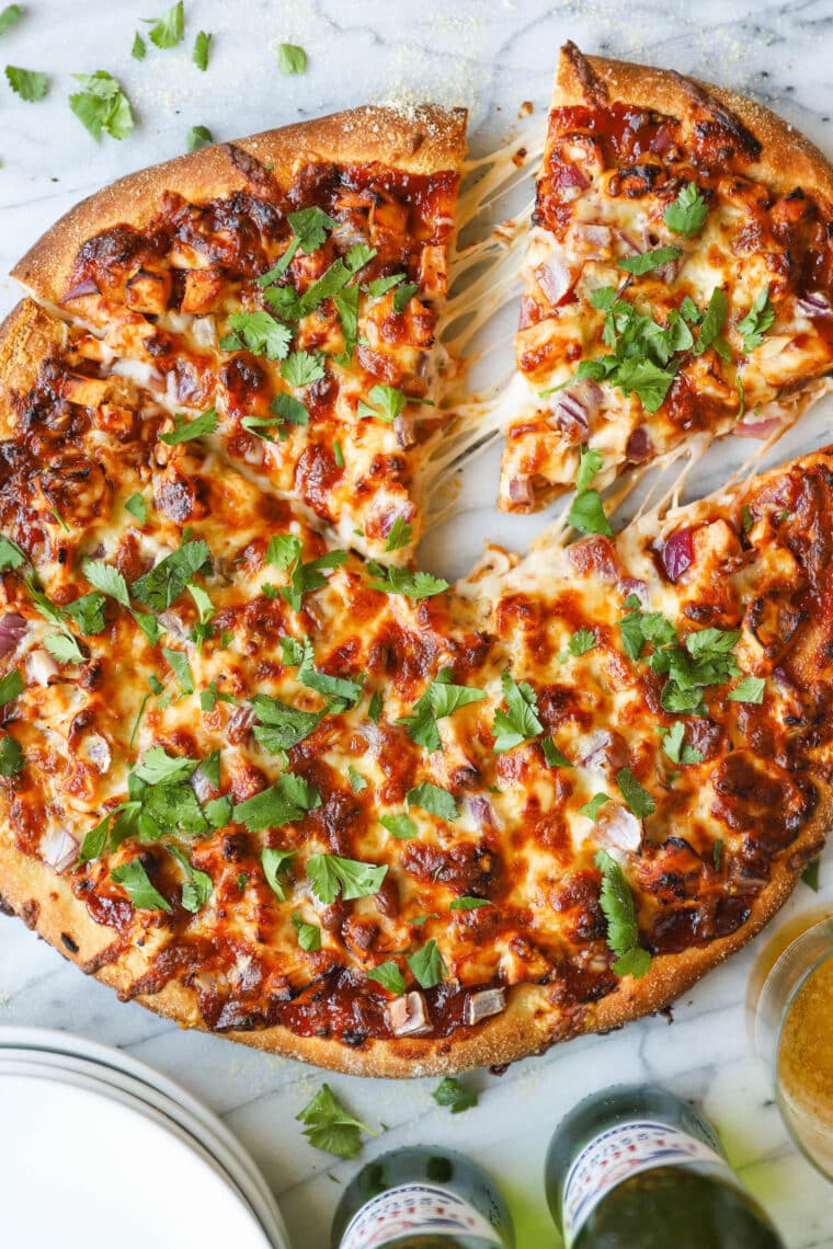 BBQ Chicken Pizza - You can use homemade pizza dough (or store-bought) with leftover rotisserie chicken for the best (speediest) dinner ever!