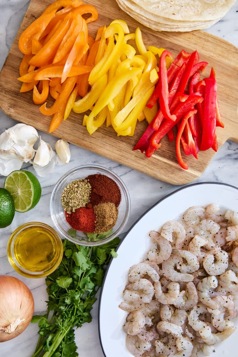 Sheet Pan Shrimp Fajitas - The quickest (easiest) sheet pan dinner! Serve with warm tortillas for a lightening fast weeknight meal. SO GOOD!