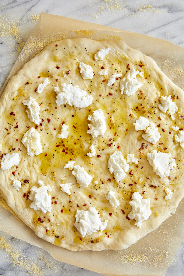 White Pizza - Made with 3 different cheeses (no tomato sauce here!) and drizzled with extra-virgin olive oil, garlicky goodness. Yes, please!