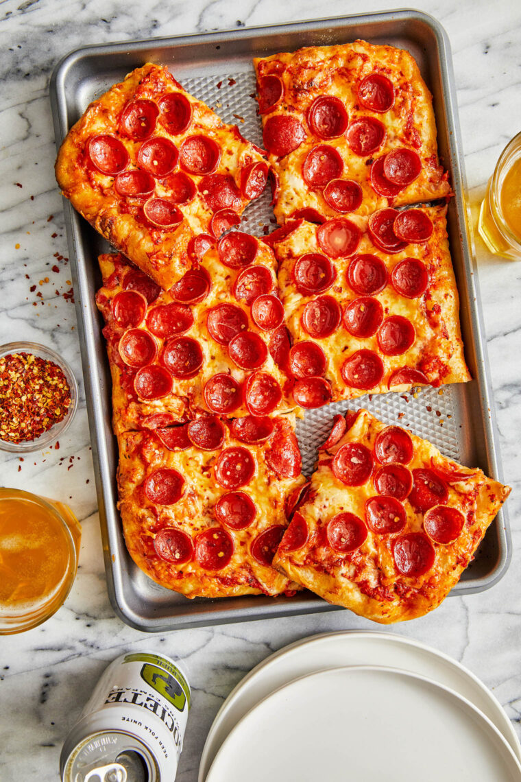 Sheet Pan Pizza - SO EASY + family-friendly! Keep it plain with cheese or add all your favorite toppings - pepperoni, sausage, and/or veggies!