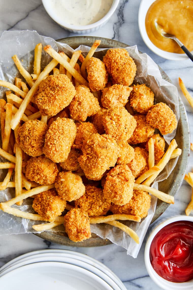 Baked Chicken Nuggets - The BEST crisp-tender chicken nuggets that are completely oven baked! Serve with ketchup, honey mustard or Ranch!