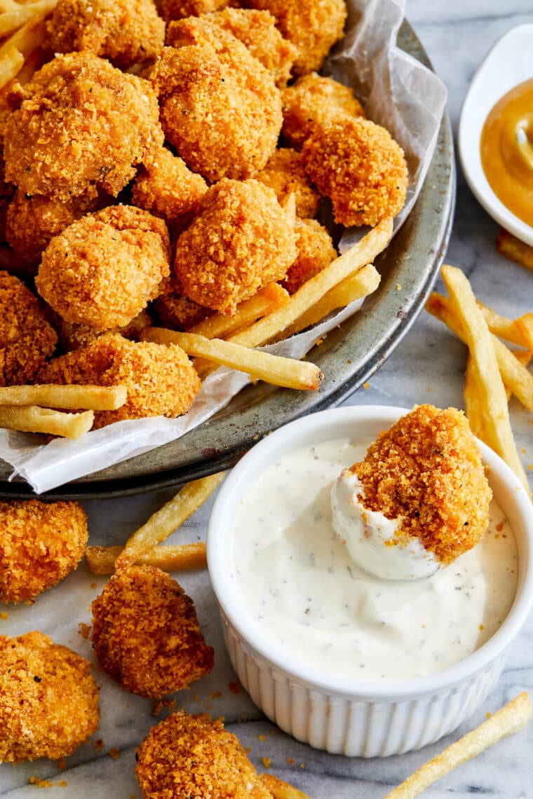 Baked Chicken Nuggets - The BEST crisp-tender chicken nuggets that are completely oven baked! Serve with ketchup, honey mustard or Ranch!