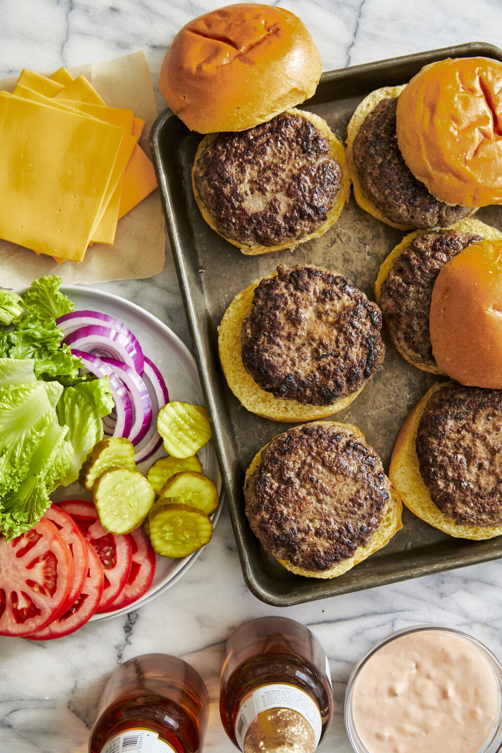 Serve on toasted brioche hamburger buns with chosen toppings (all the bread and butter pickles for me). And don't forget to pick up some high-quality American cheese (or your preferred variety if you're not a fan of American cheddar).