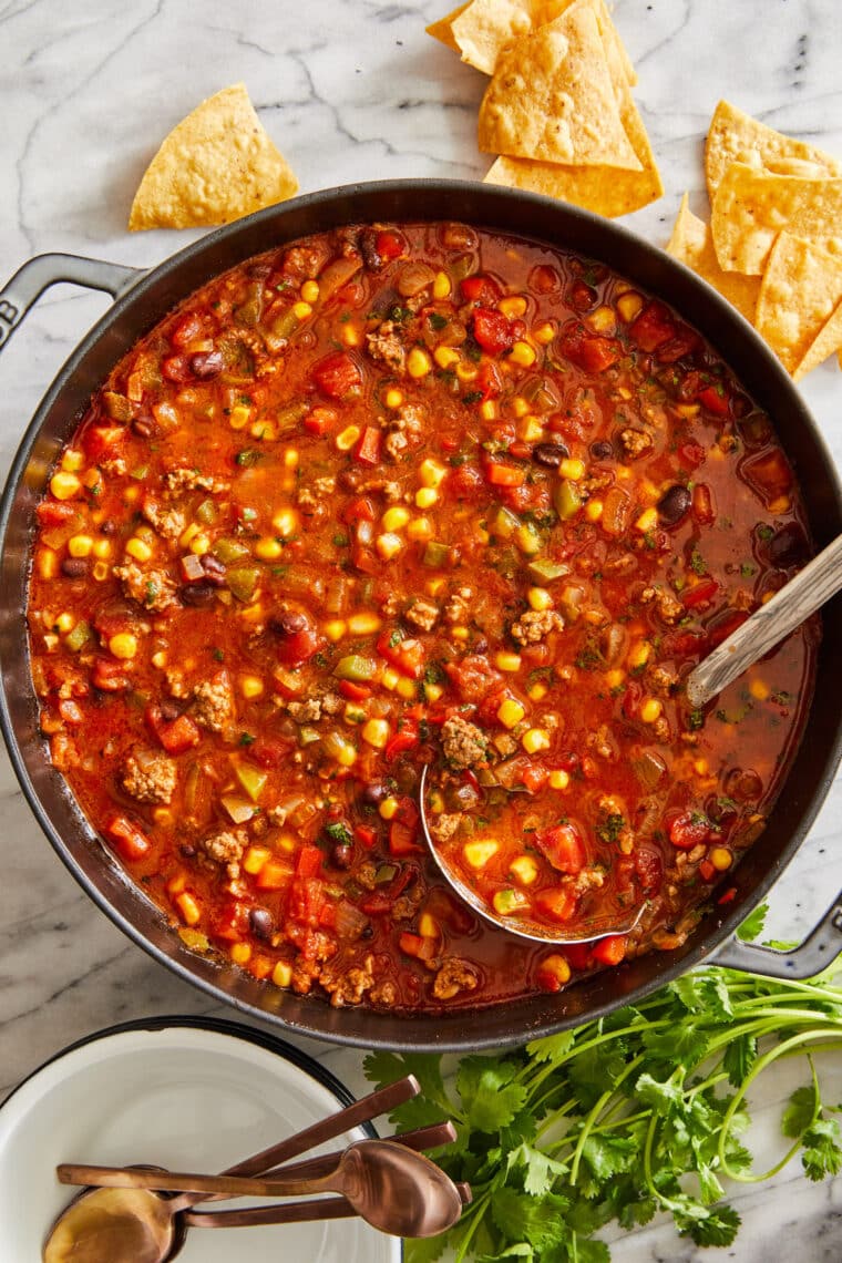 Easy Taco Soup - THE BEST taco soup ever! So hearty, so cozy and incredibly budget-friendly. Makes a big batch too - perfect for freezing!