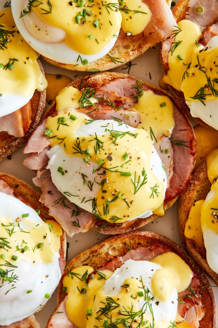 Classic Eggs Benedict - Truly the BEST eggs benedict recipe you can make right at home! Made with the creamiest benedict (hollandaise) sauce.