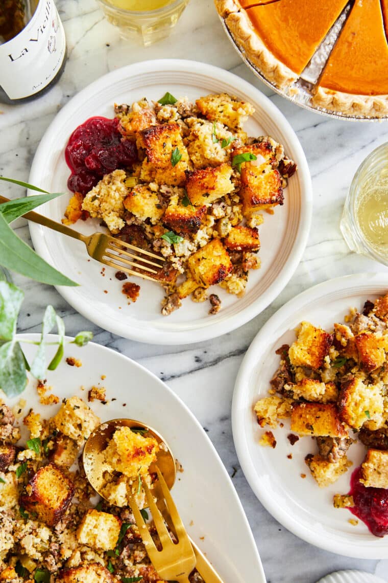 Cornbread Stuffing - Made with homemade cornbread, crumbled sausage, fresh sage and thyme. So crumbly and so good. Truly a family-favorite!