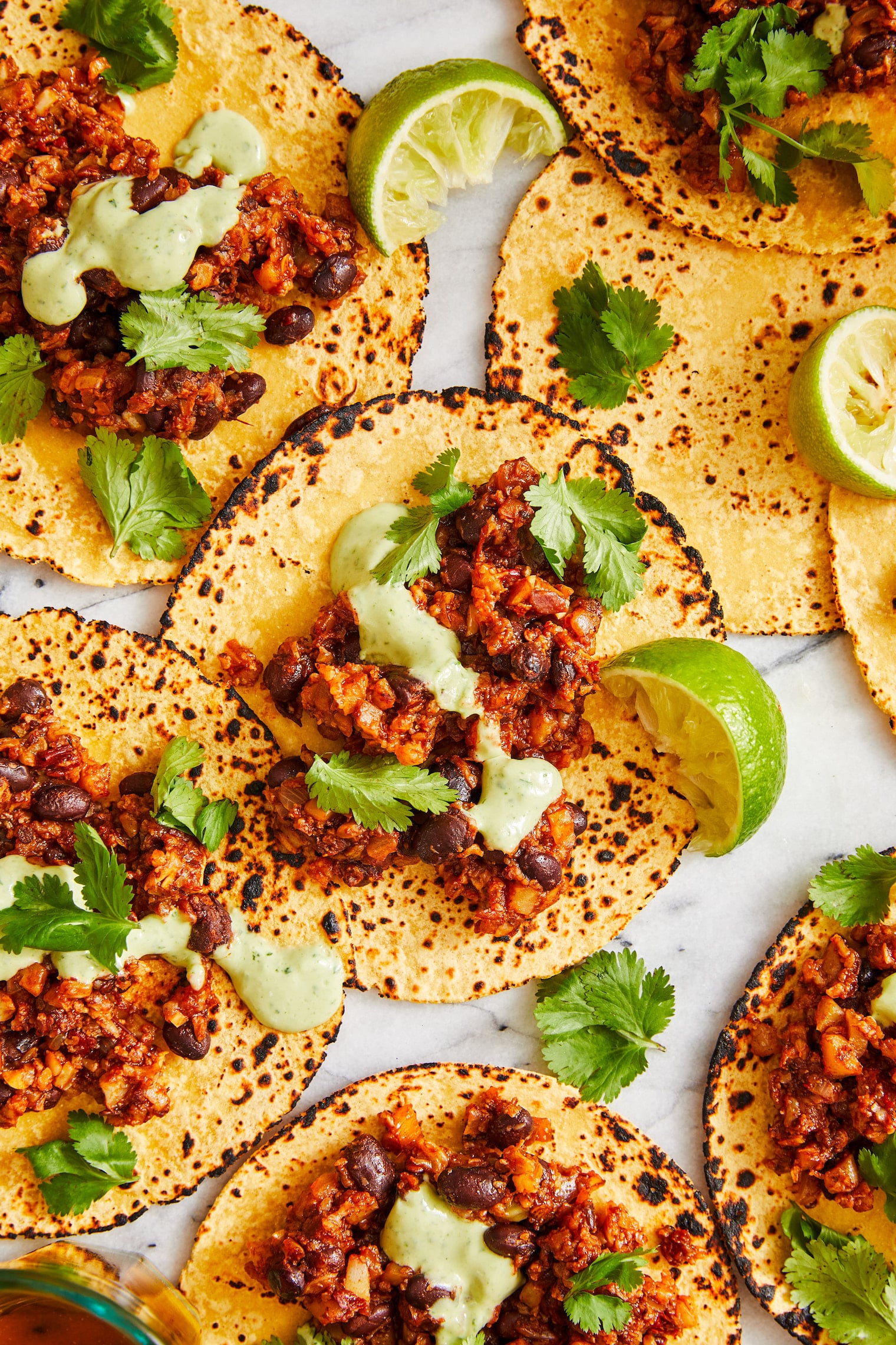 Cauliflower Tacos - SO PERFECT FOR TACO NIGHT! Completely vegetarian and so easy to make, topped with the best avocado crema sauce. SO GOOD.