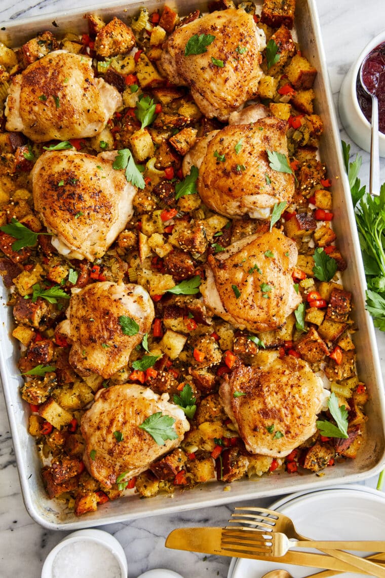 Sheet Pan Chicken and Stuffing - The best no-fuss SHEET PAN DINNER! Crisp, juicy chicken thighs baked alongside my favorite stuffing recipe.