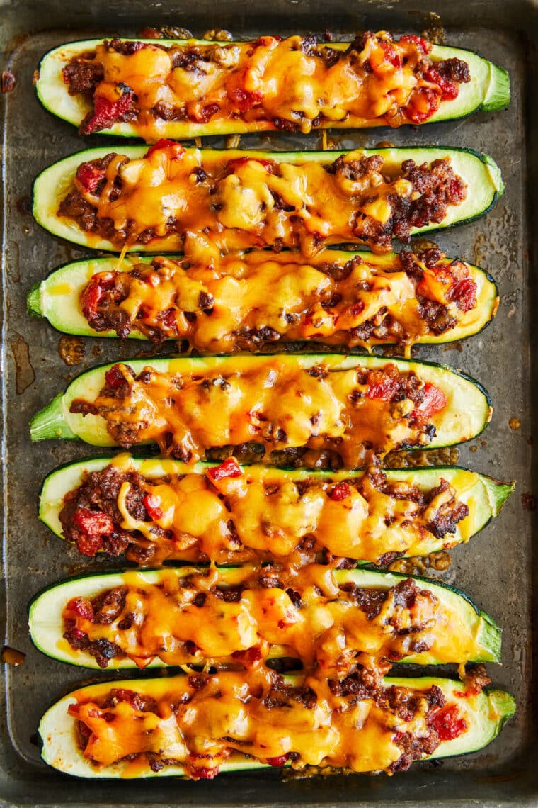 Taco Zucchini Boats - A low carb dinner recipe for the whole family!  Stuffed with ground beef and taco seasoning, baked to cheesy perfection.