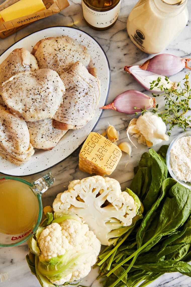 Chicken and creamy cauliflower - soft and juicy golden brown chicken cooked in a heavenly cream sauce with roasted cauliflower + baby spinach!