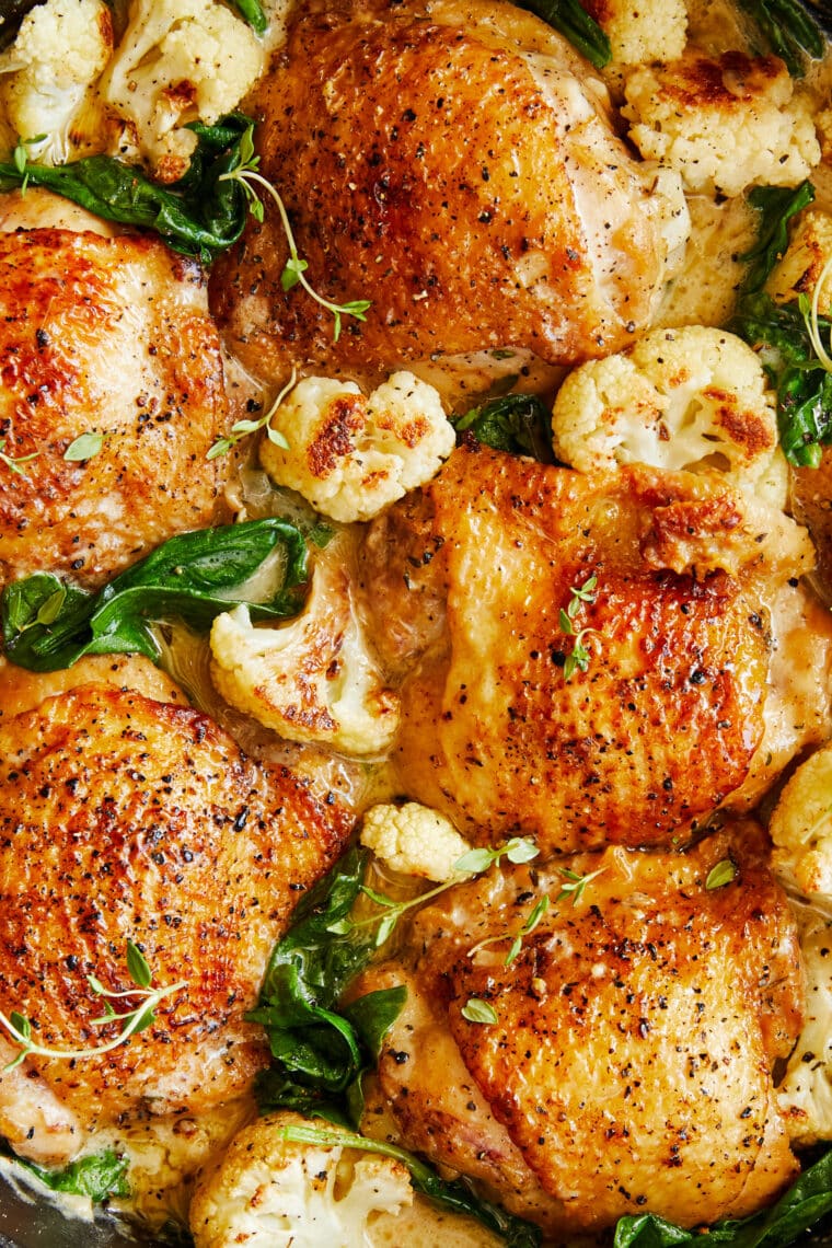 Chicken and creamy cauliflower - soft and juicy golden brown chicken cooked in a heavenly cream sauce with roasted cauliflower + baby spinach!