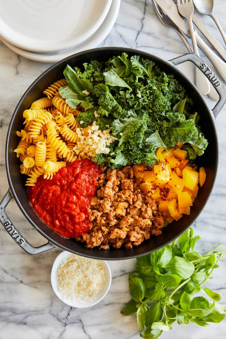 Pasta dish made from crumbled Italian sausage, fusilli pasta, torn kale, bell pepper and marinara sauce.