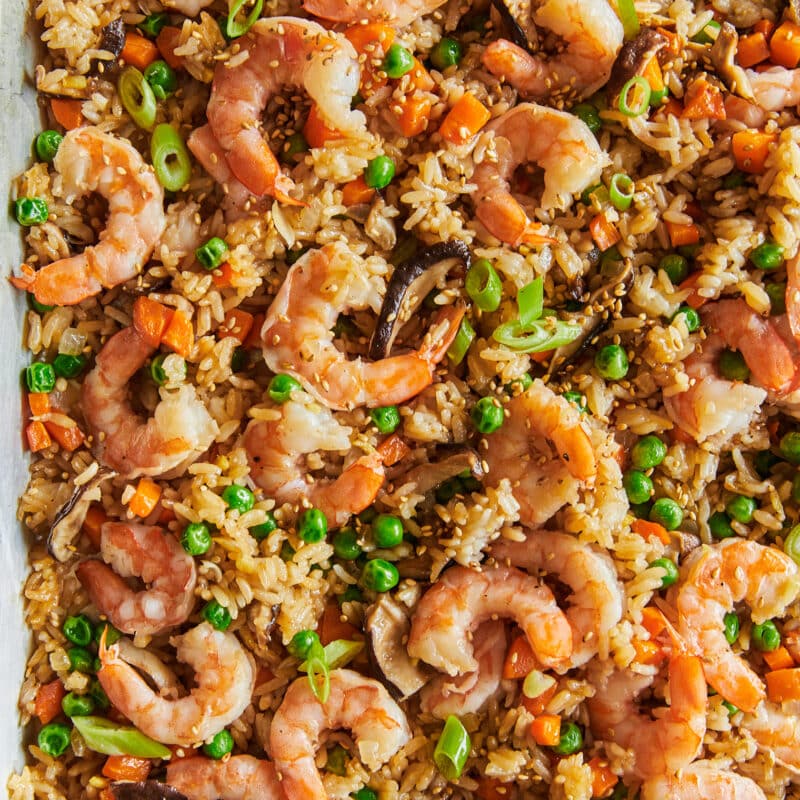 Leftover rice, pan fried with cooked shrimp and peas, shiitake mushrooms, carrots, onions a sauces.