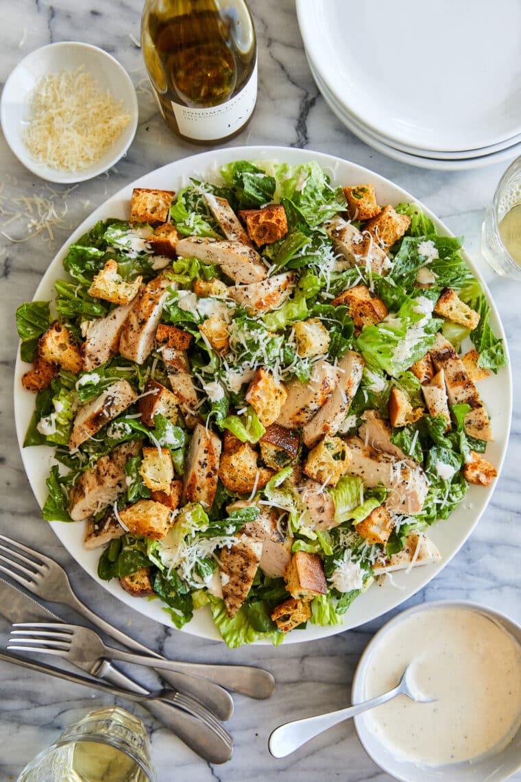 Best Chicken Caesar Salad with Homemade Croutons - Truly THE BEST ever. With crispy, seasoned croutons, grilled chicken and an easy dressing!