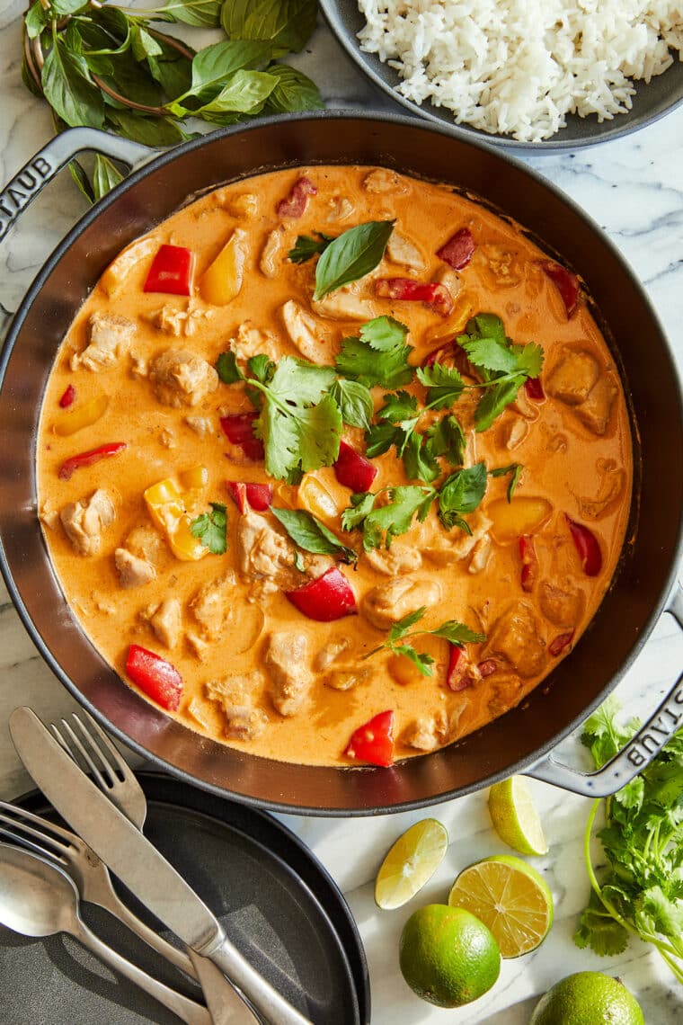 Coconut Curry Chicken - 1000x better than takeout! Tender chicken + veggies in a heavenly curry sauce. Serve over rice to sop up everything!