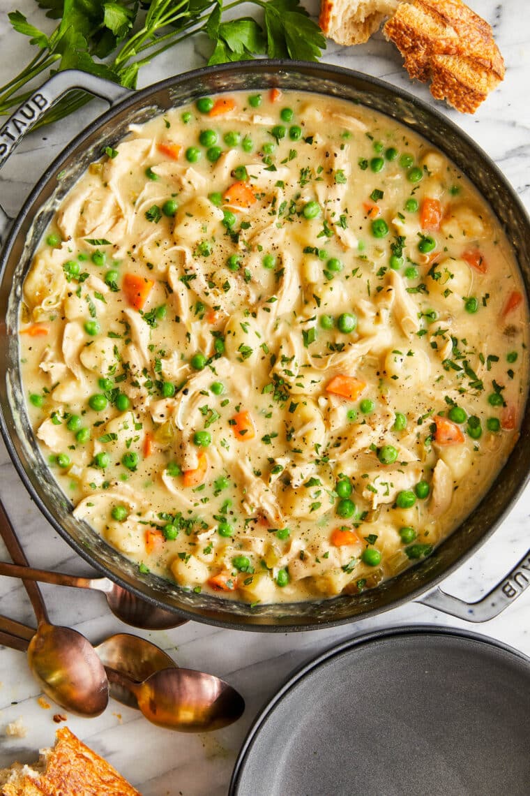 Chicken and Dumplings - A creamy, hearty chicken stew with vegetables and homemade light and fluffy dumplings! Comes together so quick too!