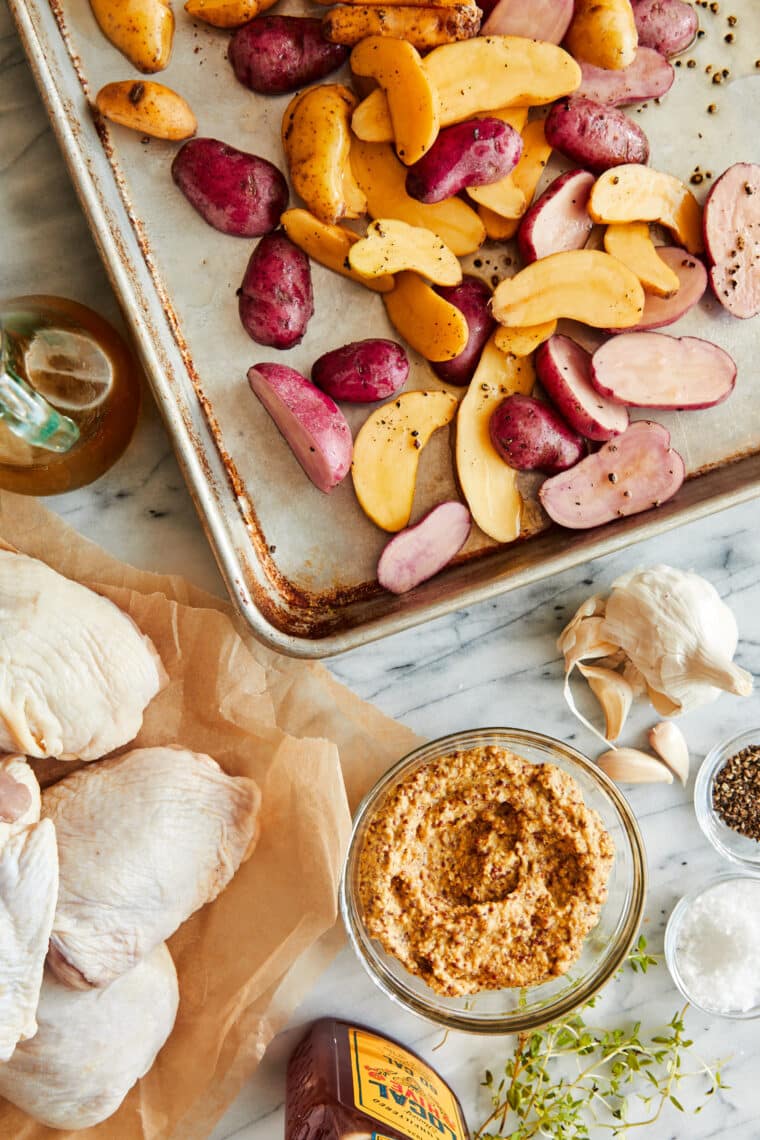 Sheet Pan Honey Mustard Chicken and Potatoes - ONE POT EASY DINNER! Tender, oh-so-juicy oven baked chicken in THE BEST honey mustard sauce.