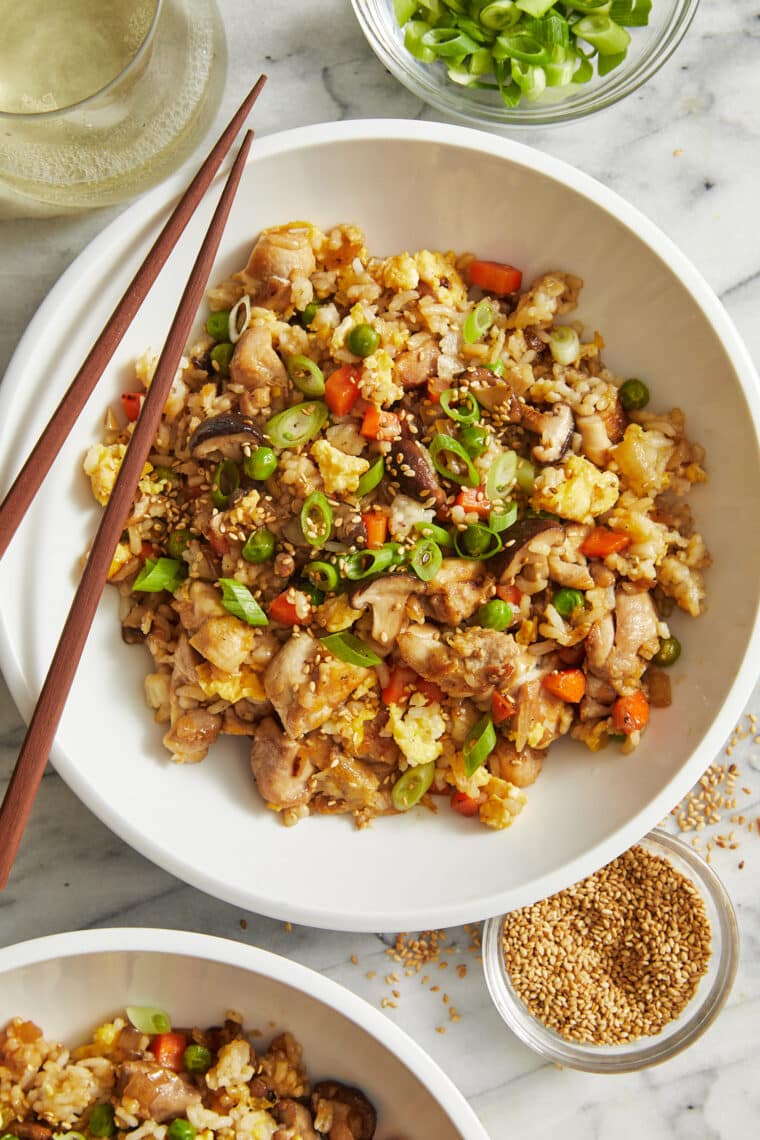 Easy Chicken Fried Rice - Comes together so quickly with leftover rice! Made with chicken, eggs, vegetables and white or brown rice. SO GOOD.