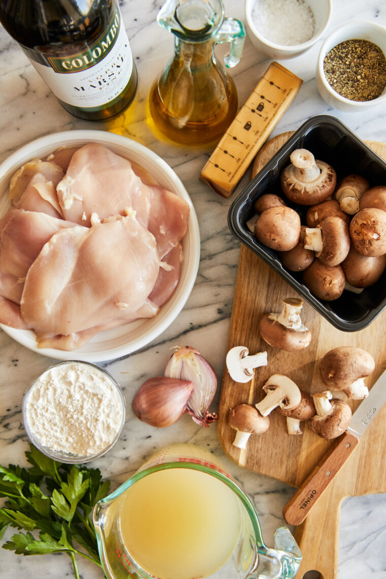 Creamy Chicken Marsala - A classic Italian dish EVERYONE will love! Pan-fried chicken in the most amazing marsala-mushroom cream sauce! YUM!