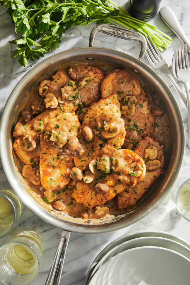 Creamy Chicken Marsala - A classic Italian dish EVERYONE will love! Pan-fried chicken in the most amazing marsala-mushroom cream sauce! YUM!