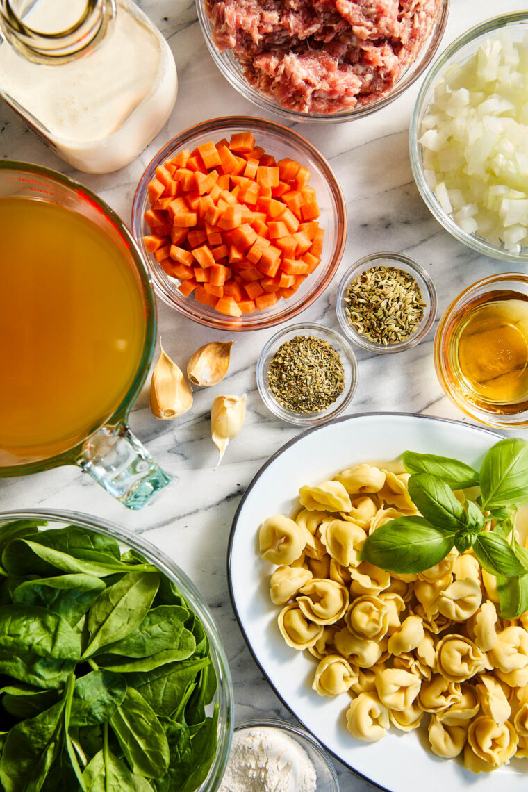 Sausage Tortellini Soup - Quick, easy weeknight meal made in 40 min! With crumbled sausage, tortellini, spinach, cream and basil. So creamy!