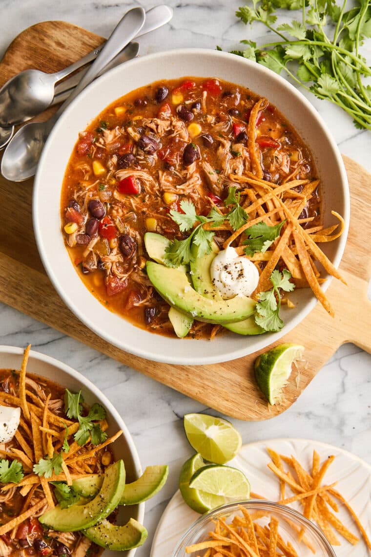 Slow Cooker Chicken Tortilla Soup - Restaurant-quality with so much flavor! No sautéing, no babysitting here with 5 min prep. Set and forget!