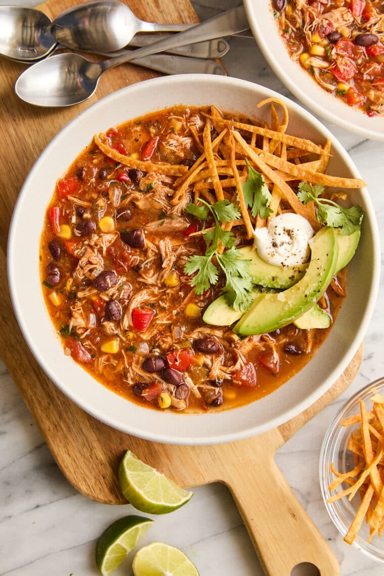 Slow Cooker Chicken Tortilla Soup - Restaurant-quality with so much flavor! No sautéing, no babysitting here with 5 min prep. Set and forget!