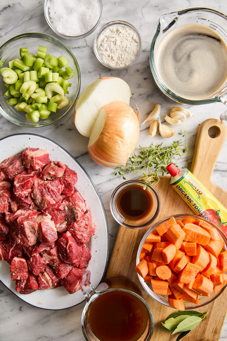 Guinness Beef Stew - A deep, rich beef stew so flavorful with veggies + the most tender fall-apart beef. Serve over mashed potatoes. So good!