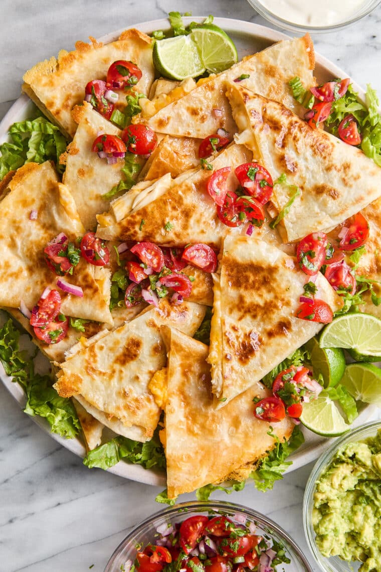 Easy Chicken Quesadillas - The best cheesy quesadillas! Golden brown crispy on the outside, perfectly melted on the inside. A 20 min recipe!